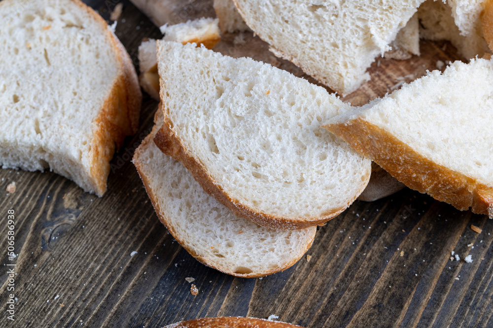 sliced loaf of bread on a cutting wooden board sliced loaf of bread on a cutting wooden board