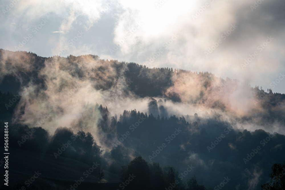 sunrise with fog in the mountains after a rainy night