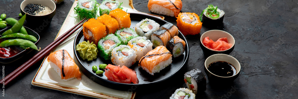 Sushi assortment on dark background. Sushi assortment on dark background.