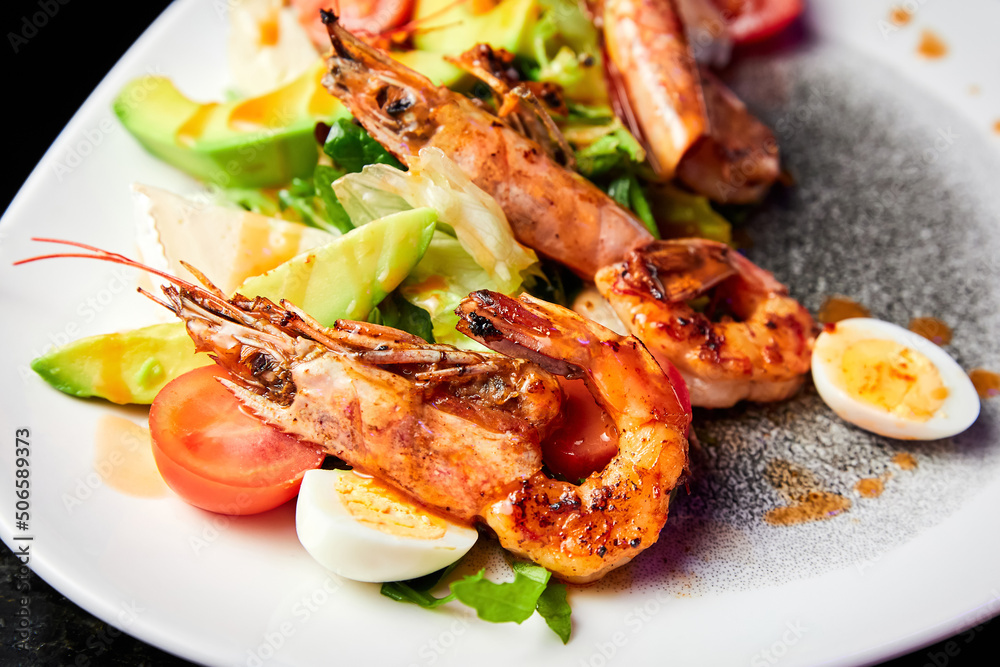 Salad with avocado, tiger prawns, tomatoes and quail eggs Salad with avocado, tiger prawns, tomatoes and quail eggs