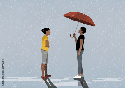 Woman standing in rain looking at husband under umbrella
 photo