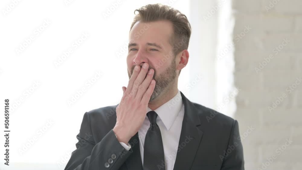 Middle Aged Businessman Feeling Sleepy, Yawning Middle Aged Businessman Feeling Sleepy, Yawning