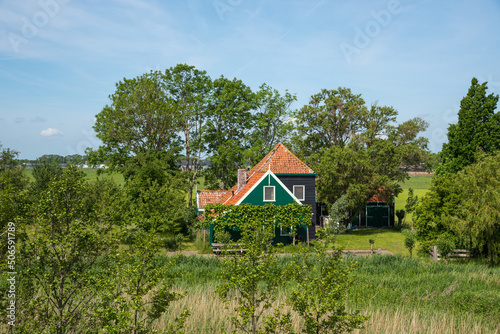 Oterleek, Netherlands, May 2022. Traditional farmhouse with barns in the countryside of western Friesland. photo
