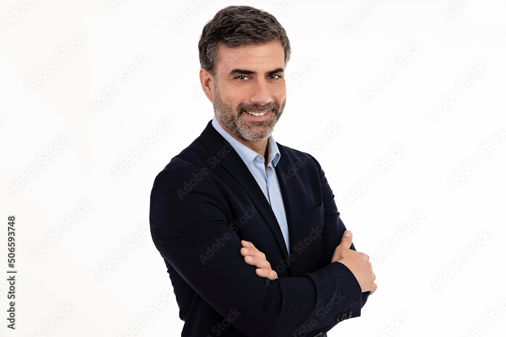 Businessman smiling with arms crossed on white background Businessman smiling with arms crossed on white background