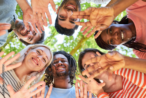 Group of people waving in the team building workshop photo