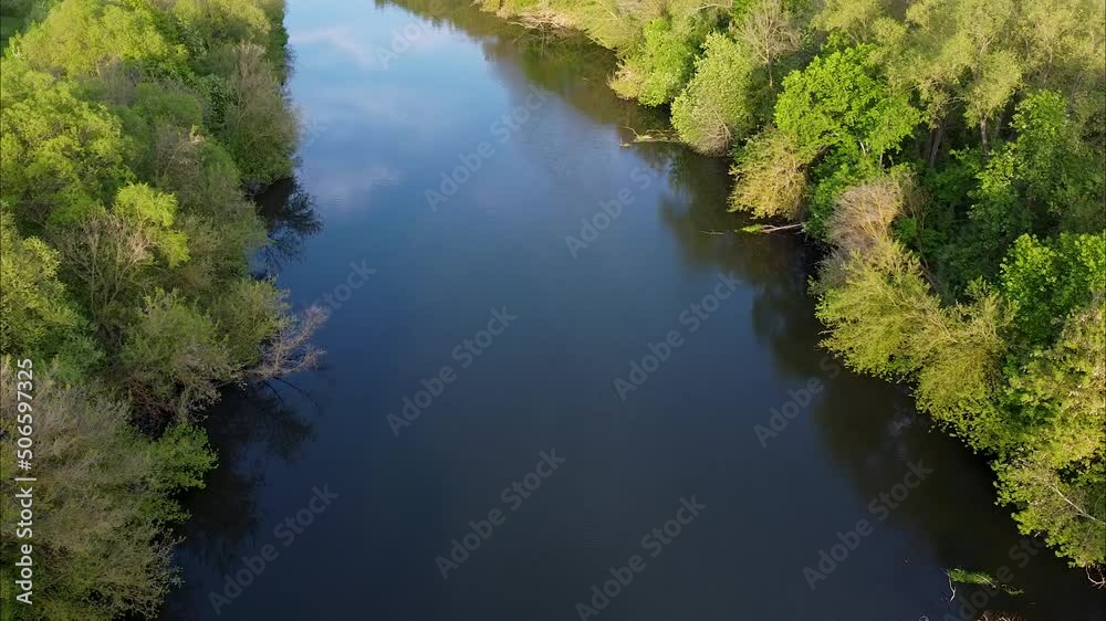 View of the river from above. Flight over water and forest trees from a height. Epic panoramic shot. Spring flood. Travel by kayak. Green background View of the river from above. Flight over water and forest trees from a height. Epic panoramic shot. Spring flood. Travel by kayak. Green background