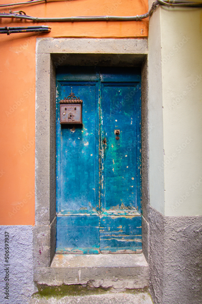 Old blue wooden front door with mailbox Old blue wooden front door with mailbox