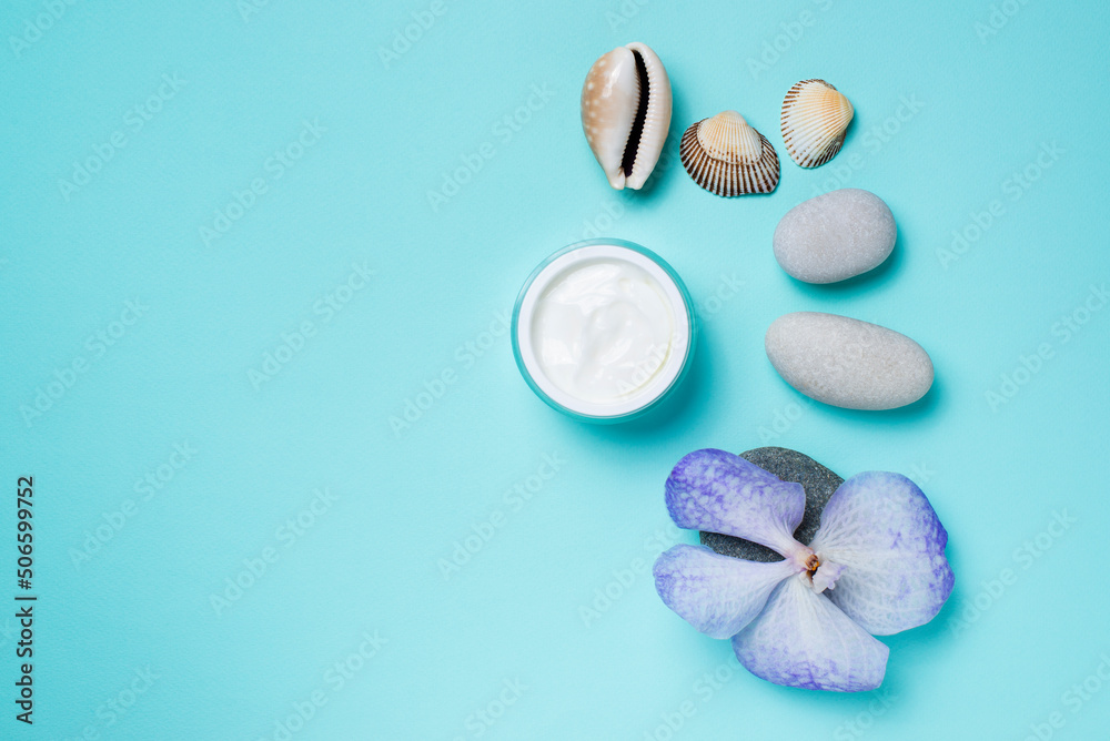 cream for face,blue orchid,stones on a blue background,facial massage cream for face,blue orchid,stones on a blue background,facial massage