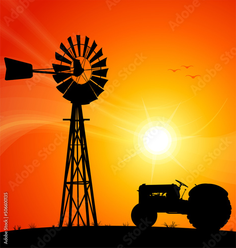 Windmill Australian silhouette sunset with tractor