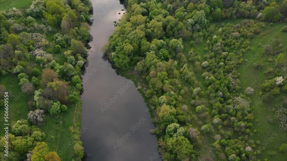 View of the river from above. Flight over water and forest trees from a height. Epic panoramic shot. Spring flood. Travel by kayak. Green background View of the river from above. Flight over water and forest trees from a height. Epic panoramic shot. Spring flood. Travel by kayak. Green background