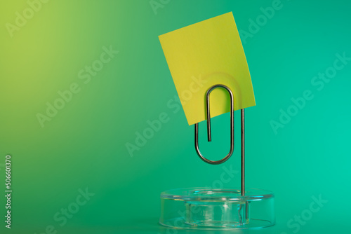 Sticky note and paperclip