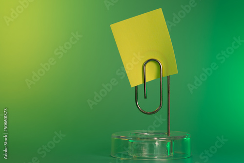 Sticky note and paperclip
