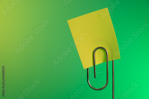 Sticky note and paperclip
