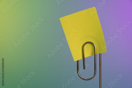 Sticky note and paperclip