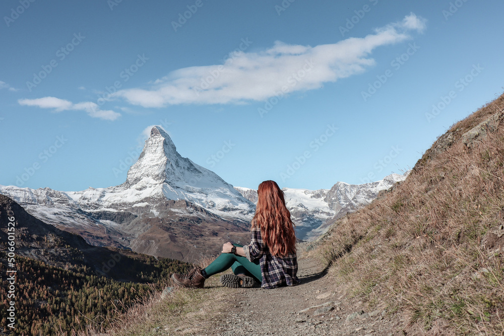 Woman staring at the beautiful Matterhorn glacier in Zermatt, Switzerland.