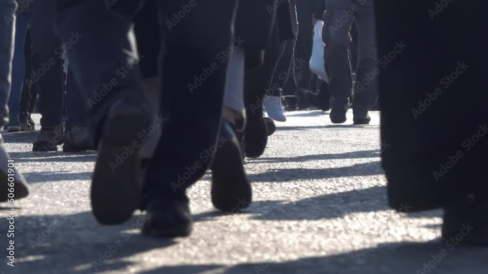 Crowd of anonymous people walking on busy city street pedestrians and tourists. Crowd of anonymous people walking on busy city street pedestrians and tourists.