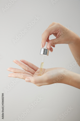 Front view of hand model using cosmetic in white background © Tuan  Nguyen 