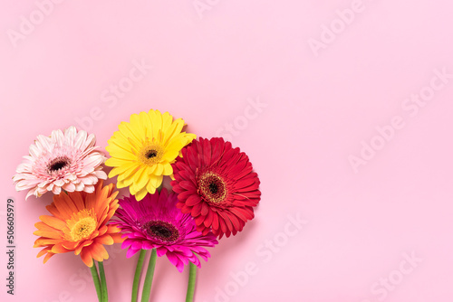Bouquet of gerberas on pink background Top view Flat lay Holiday greeting card Happy moter's day, 8 March, Valentine's day, Easter concept Copy space Mock up
