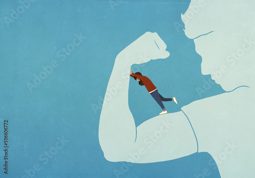 Woman resisting flexing biceps of man
 photo