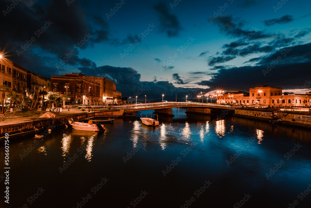 Long exposition on the illuminated harbour of Ortigia, Syracuse by night