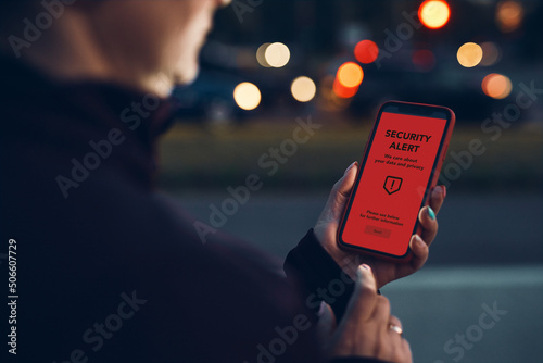 Security alert on smartphone screen. Antivirus warning. Private data protection system notification. Important security issue. Concept of cyber crime, hacking password and bank accounts, stealing data