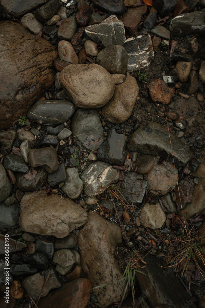 Large wet stones on the ground. Mountain road Large wet stones on the ground. Mountain road