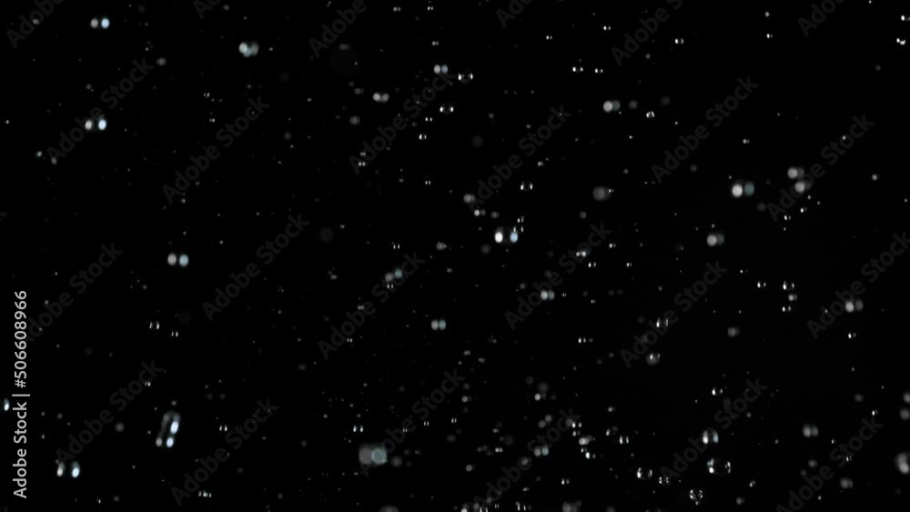 Super slow motion of realistic rain shower on black background Super slow motion of realistic rain shower on black background