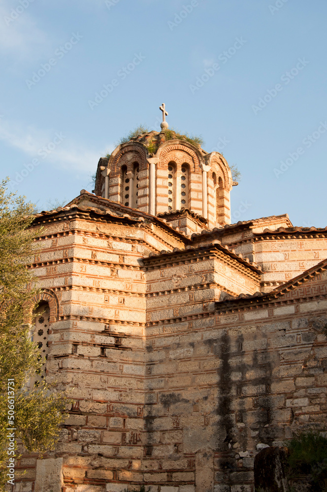 Ancient stone church with cross on dome religious building architecture sky background