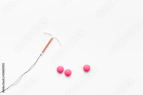 T-shaped intrauterine contraceptive device with medicine pills. Alternative methods of contraception photo
