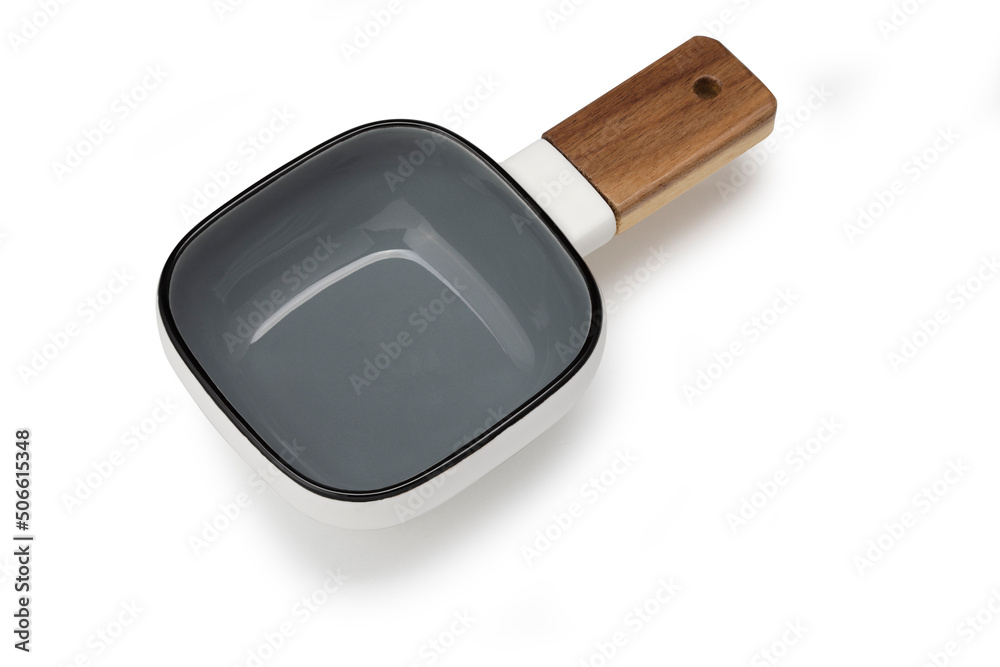 Square soup bowl with wooden handle on a white Square soup bowl with wooden handle on a white