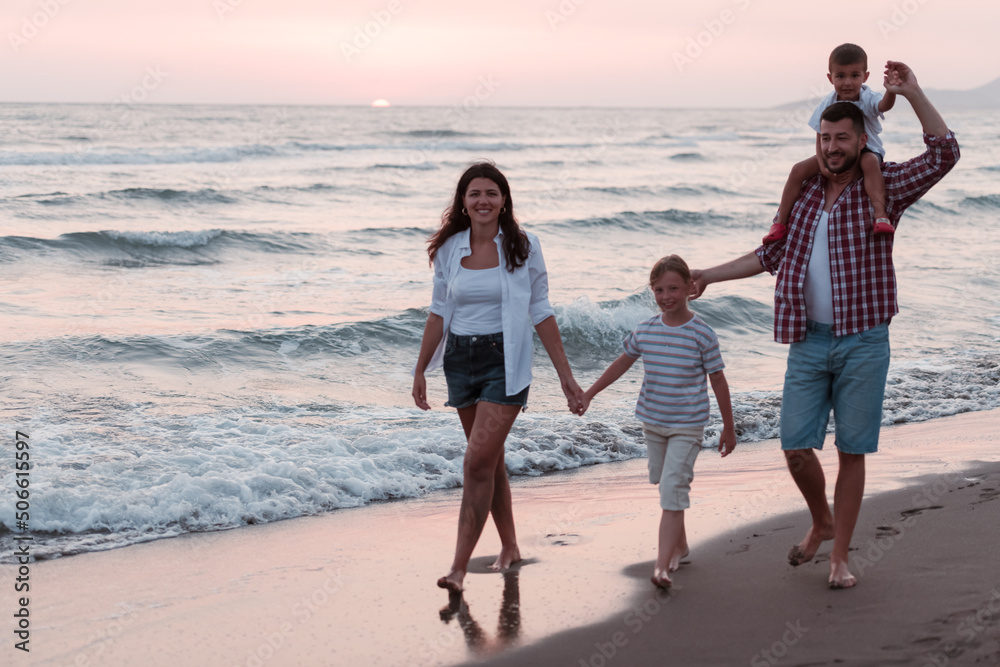 Happy young family have fun and live healthy lifestyle on beach. Selective focus Happy young family have fun and live healthy lifestyle on beach. Selective focus