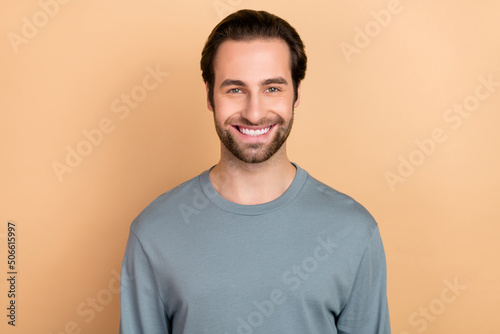 Photo of young guy good mood glad toothy smile visit dentist clinic isolated over beige color background