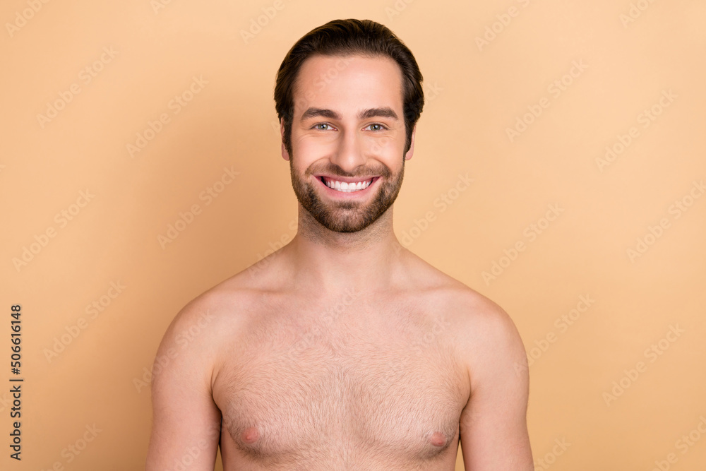 Photo of young cheerful guy toothy smile enjoy salon procedure freshness isolated over beige color background