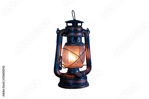 antique kerosene lamp with lights on a white background.