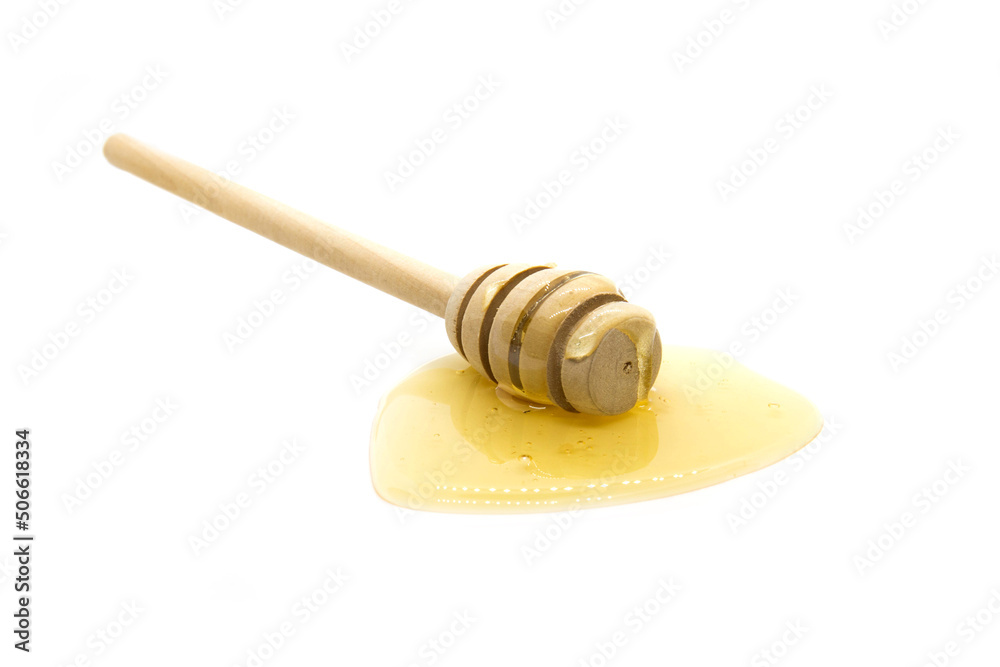 Honey dipper and honey on white background