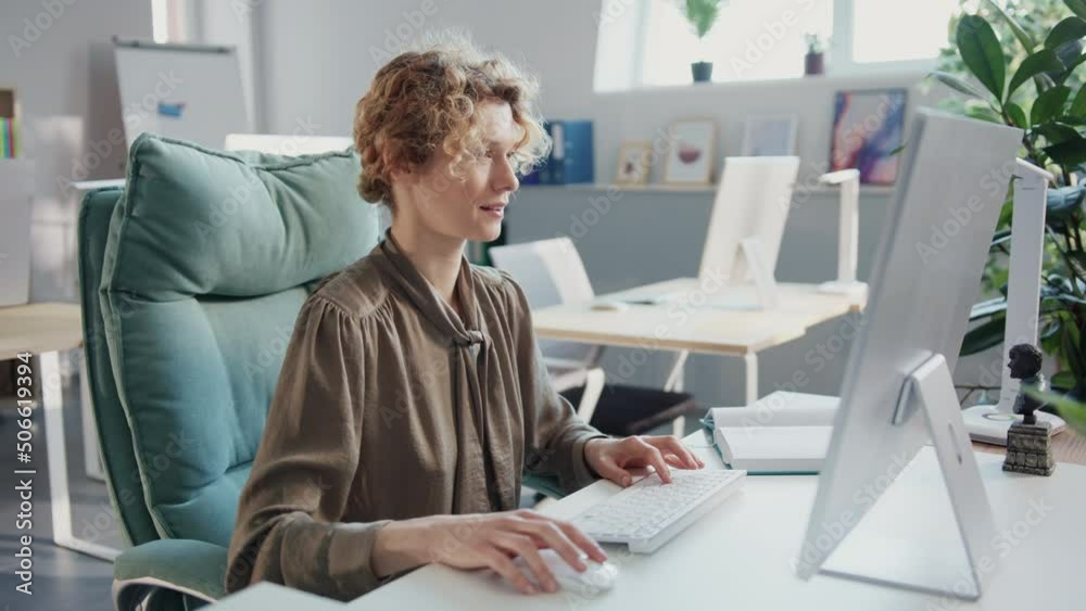 Close up wonder businesswoman working use computer in the office. Look at the screen and feel happy. Sunlight in modern office Close up wonder businesswoman working use computer in the office. Look at the screen and feel happy. Sunlight in modern office