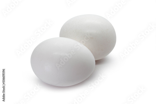  Set of two white eggs on the white background