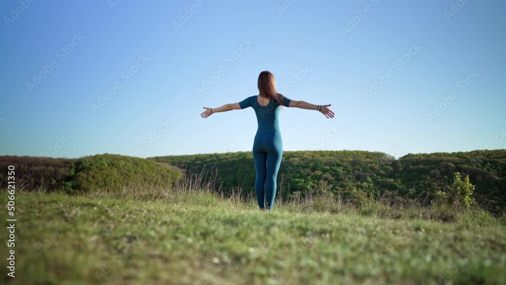 Yogi woman on top of high mountain beginning yoga practice with deep breathing. Wild nature, free human. Freedom, Healthy lifestyle, everyday practice. Lady from behind. Yogi woman on top of high mountain beginning yoga practice with deep breathing. Wild nature, free human. Freedom, Healthy lifestyle, everyday practice. Lady from behind.