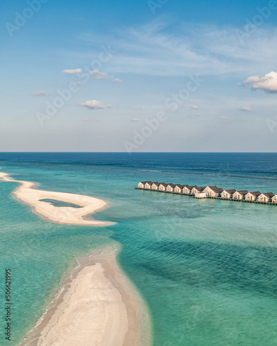 Maldives paradise scenery. Tropical aerial landscape, seascape with long jetty, water villas with amazing sea and lagoon beach, tropical nature. Exotic tourism destination banner, summer vacation 