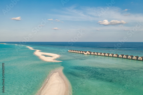Maldives paradise scenery. Tropical aerial landscape, seascape with long jetty, water villas with amazing sea and lagoon beach, tropical nature. Exotic tourism destination banner, summer vacation 