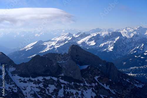 Aerial view over the Swiss Alps seen from Säntis peak at Alpstein Mountains on a sunny spring day. Photo taken April 19th, 2022, Säntis, Switzerland.