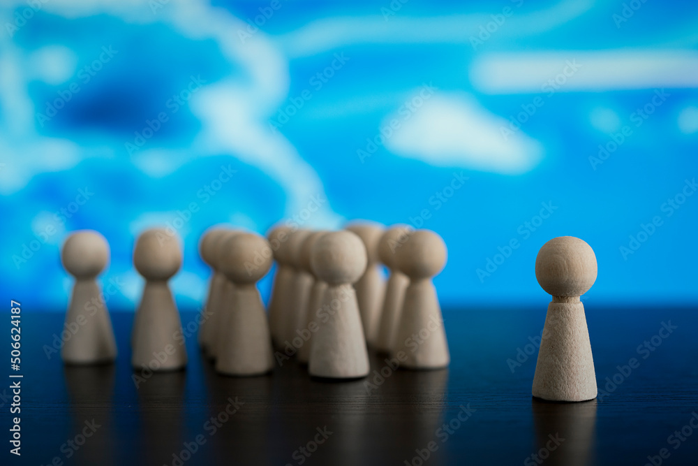 Wooden figurines in the shape of people silhouette, communication concept Wooden figurines in the shape of people silhouette, communication concept