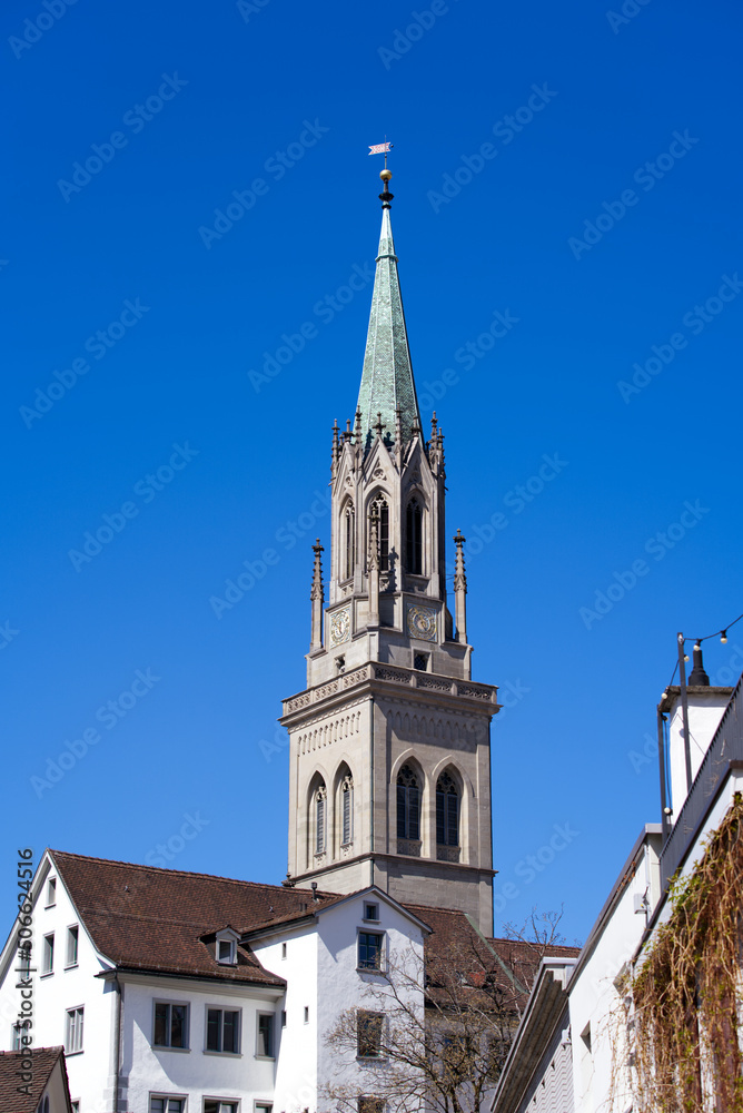Church tower of protestant church Saint Laurenzen at the old town of St. Gallen on a sunny spring day. Photo taken April 19th, 2022, St. Gallen, Switzerland. Church tower of protestant church Saint Laurenzen at the old town of St. Gallen on a sunny spring day. Photo taken April 19th, 2022, St. Gallen, Switzerland.
