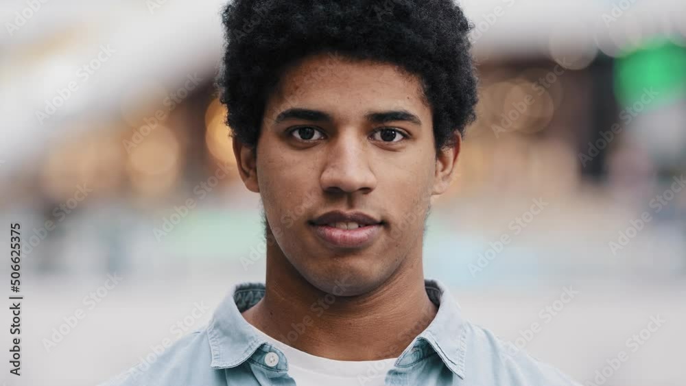 Close up male business portrait indoor 20s African Dominican biracial man guy male smiling looking at camera with calm happy face. Student boss businessman success manager client boyfriend headshot Close up male business portrait indoor 20s African Dominican biracial man guy male smiling looking at camera with calm happy face. Student boss businessman success manager client boyfriend headshot