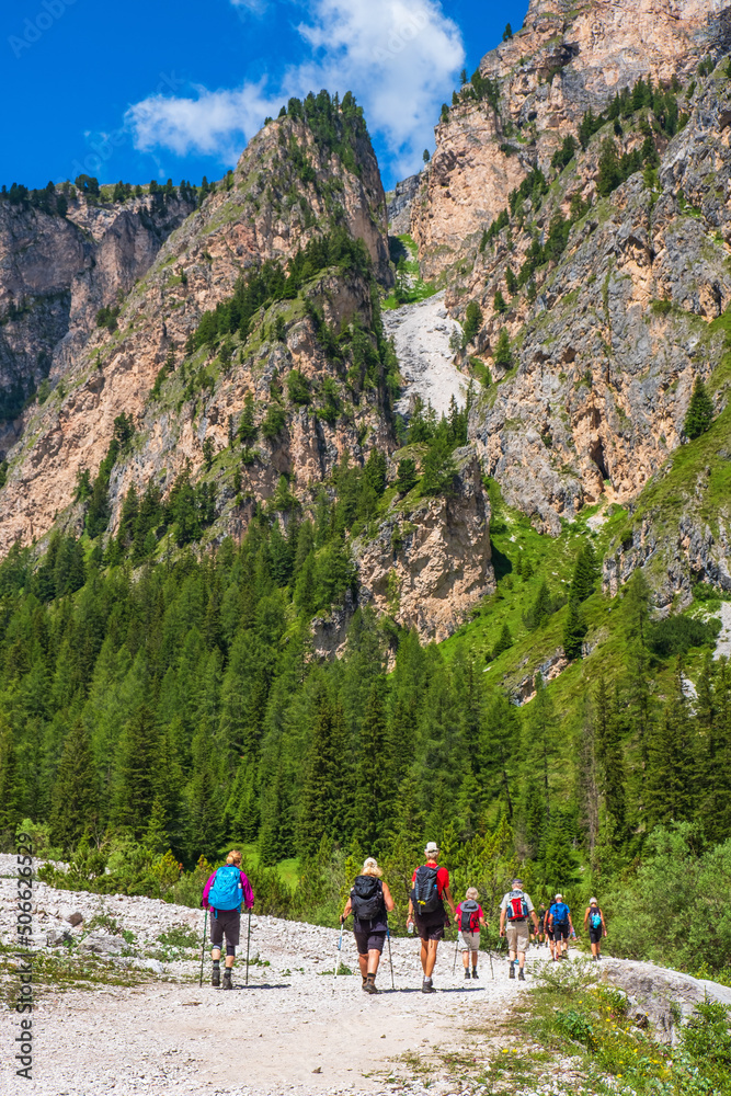 Mountain hikers on a path in a canyon
