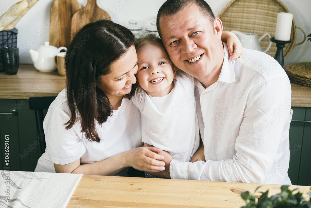 Happy family of three at home. Happy family of three at home.