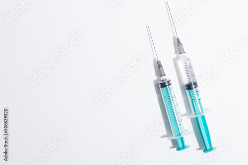 Medical syringe on a white background. A syringe for injection. The concept of health and beauty