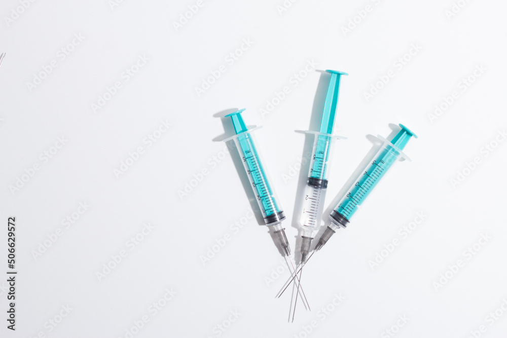 Medical syringe on a white background. A syringe for injection. The concept of health and beauty Medical syringe on a white background. A syringe for injection. The concept of health and beauty
