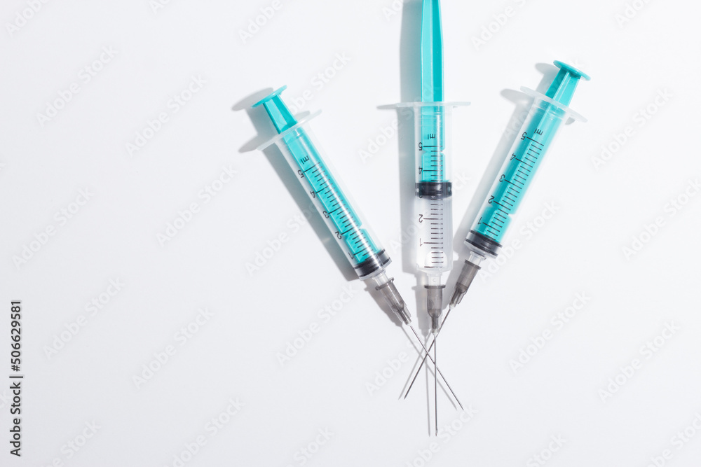 Medical syringe on a white background. A syringe for injection. The concept of health and beauty Medical syringe on a white background. A syringe for injection. The concept of health and beauty