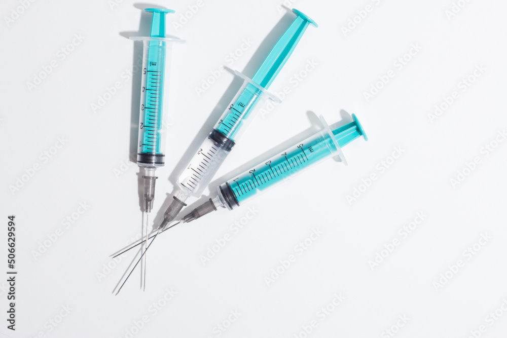 Medical syringe on a white background. A syringe for injection. The concept of health and beauty Medical syringe on a white background. A syringe for injection. The concept of health and beauty
